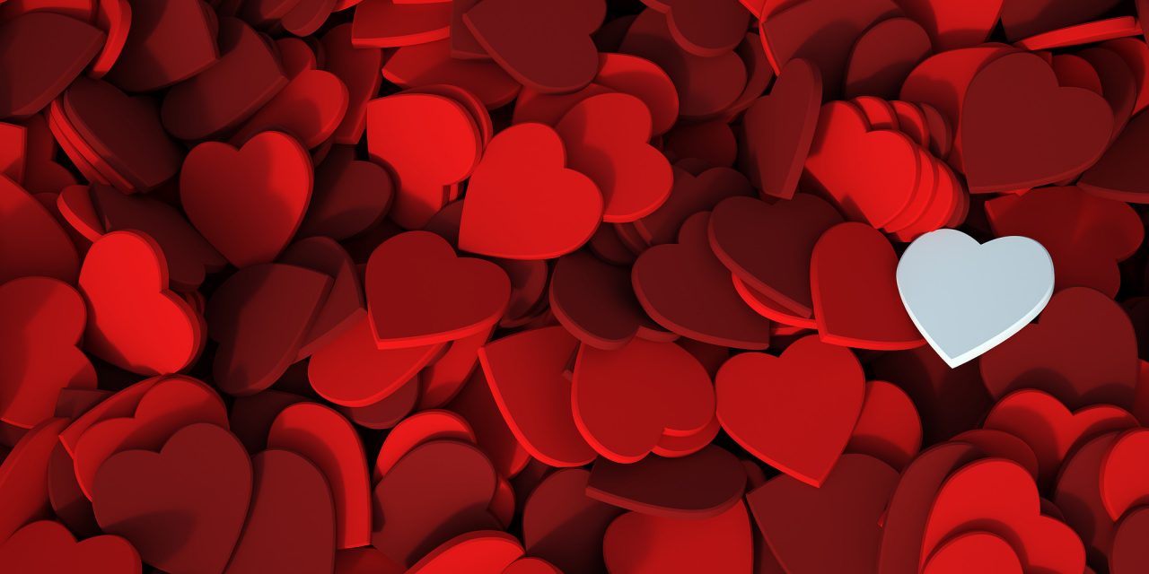 Red hearts background with a white one