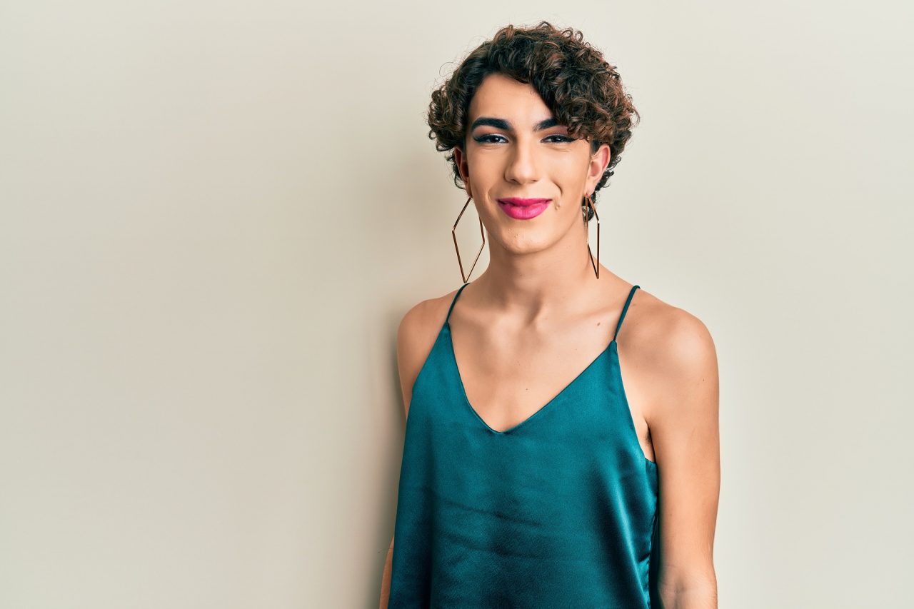 Young transgender man wearing make up and woman clothes
