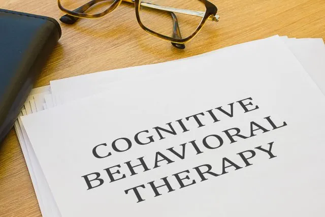 Cognitive Behavioral Therapy - written on of white paper
